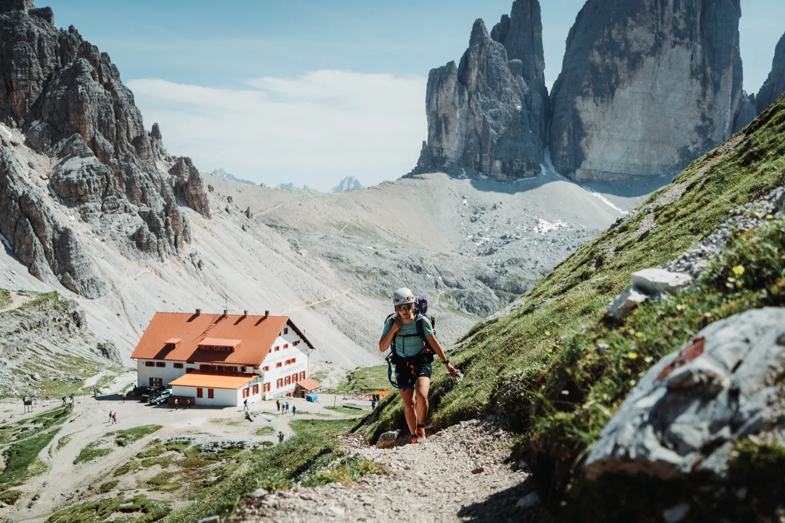 The trail passes the closed hut with a view of the Tre Cime
