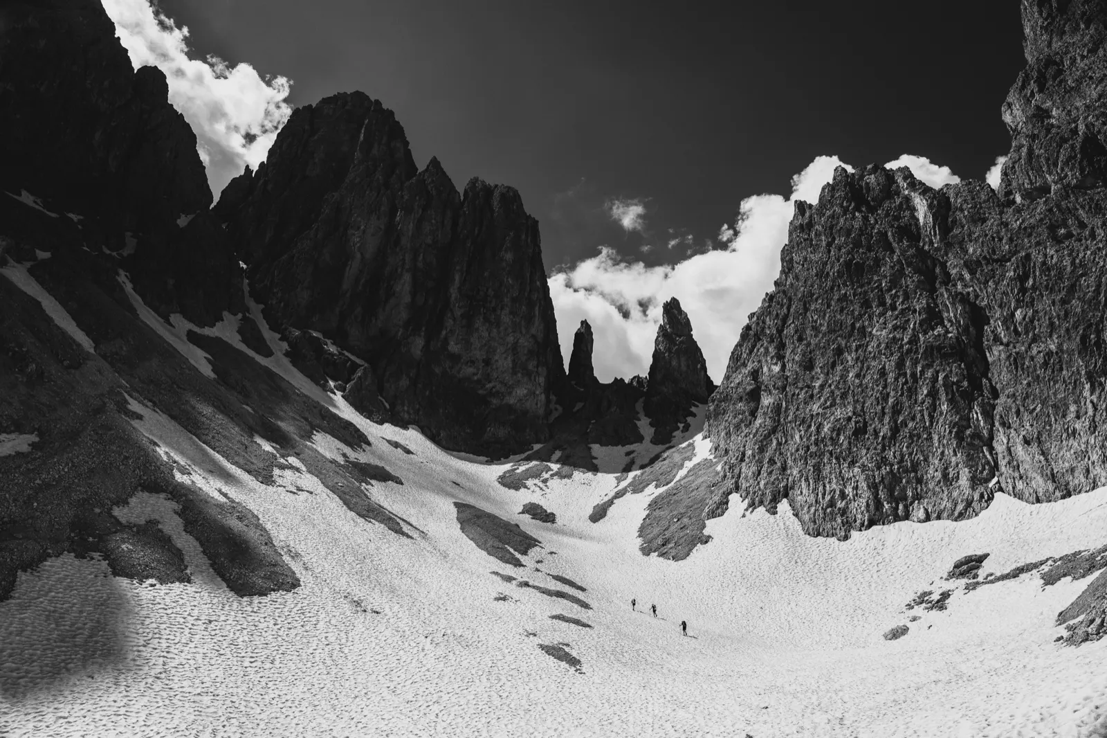 Hikers climbing towards the pass