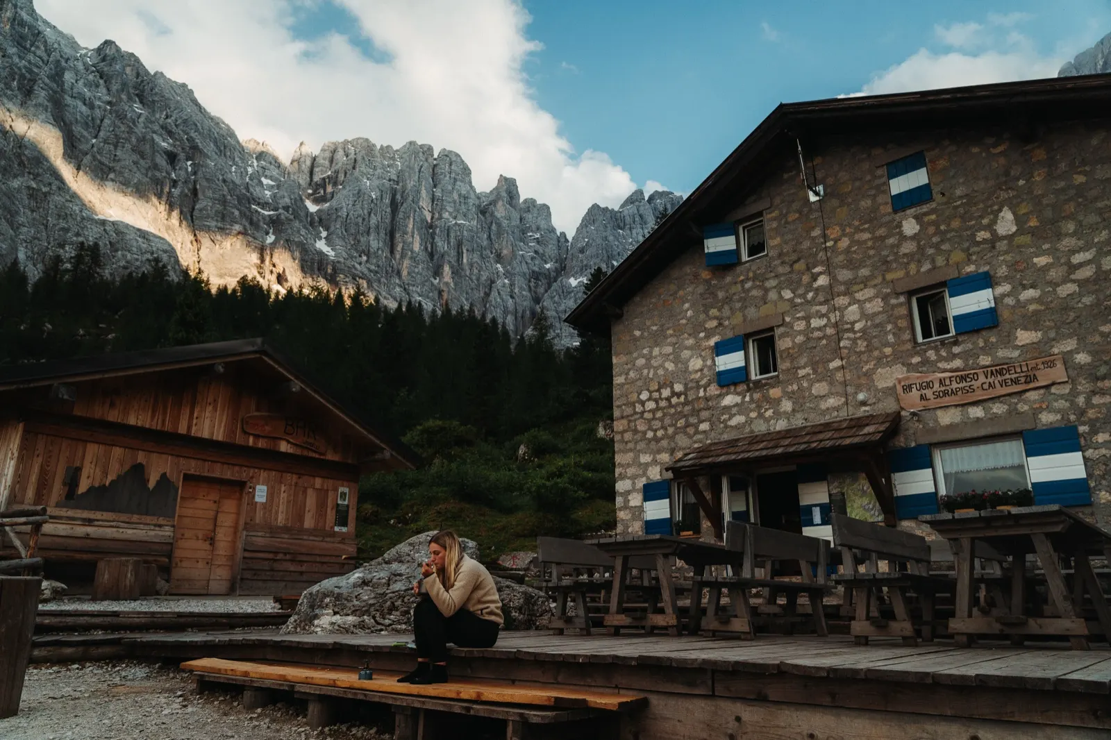 Mountain refuge Rifugio Vandelli surrounded by rocky Dolomite peaks in the early evening after a demanding climb