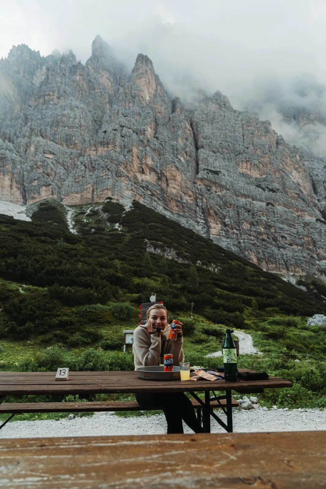 Resting over dinner beneath a rocky massif