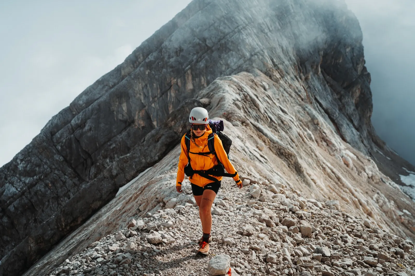 Hiker in a yellow jacket on the ridge