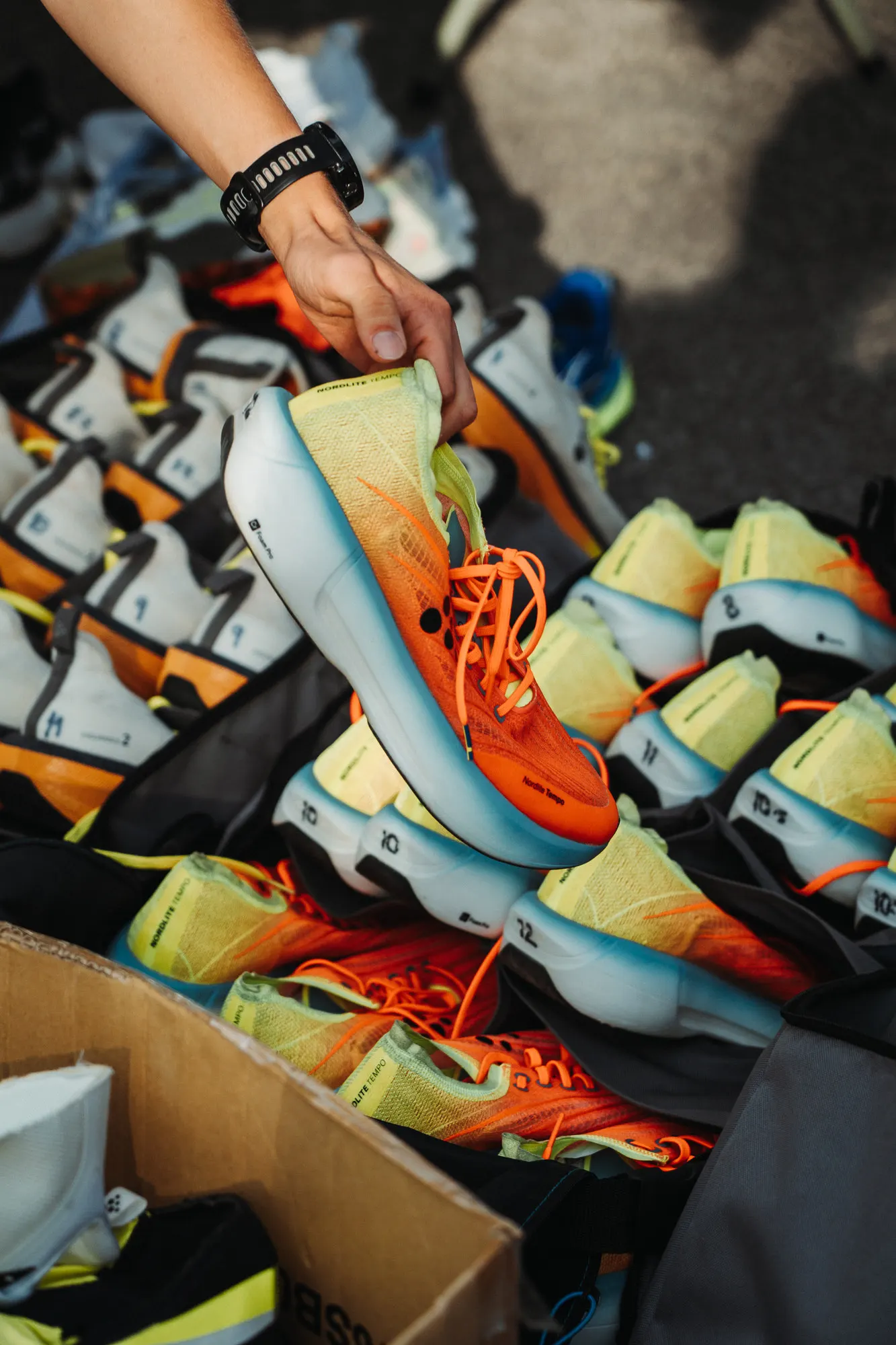 Pile of colourful Craft running shoes at the event