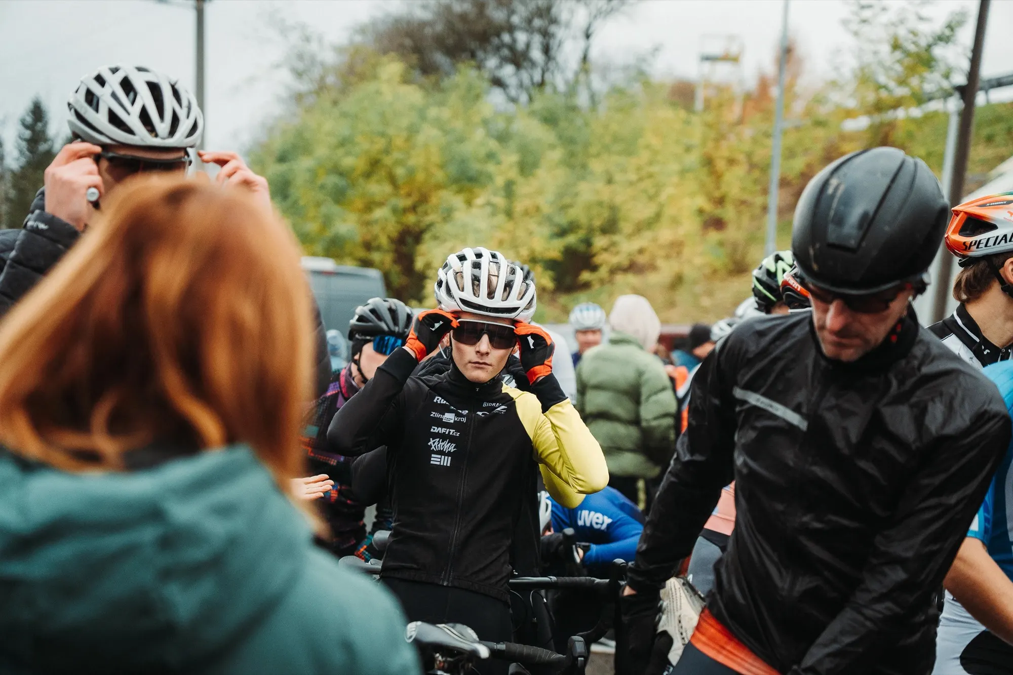 Helmeted riders waiting at the start of the cyclo-cross race